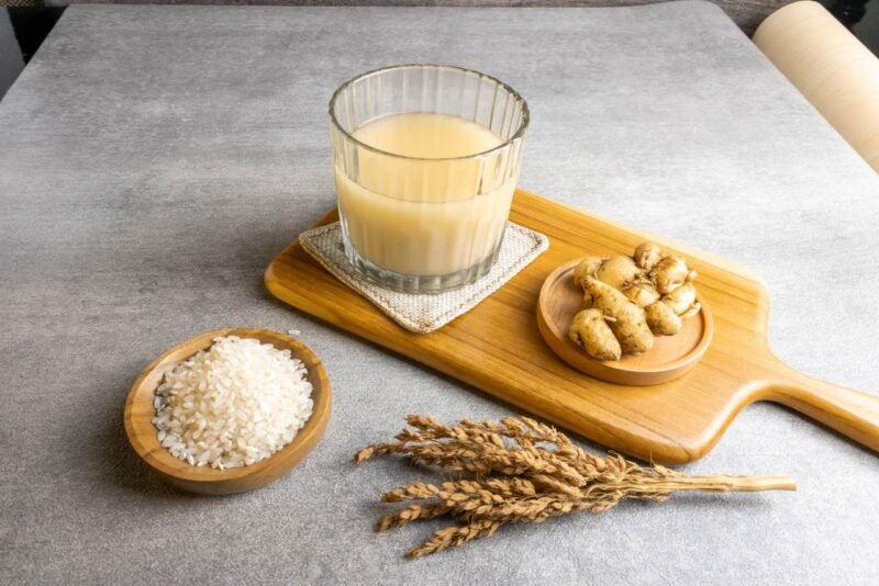 beras kencur on a glass isolated on grey background. jamu is good for diet and health